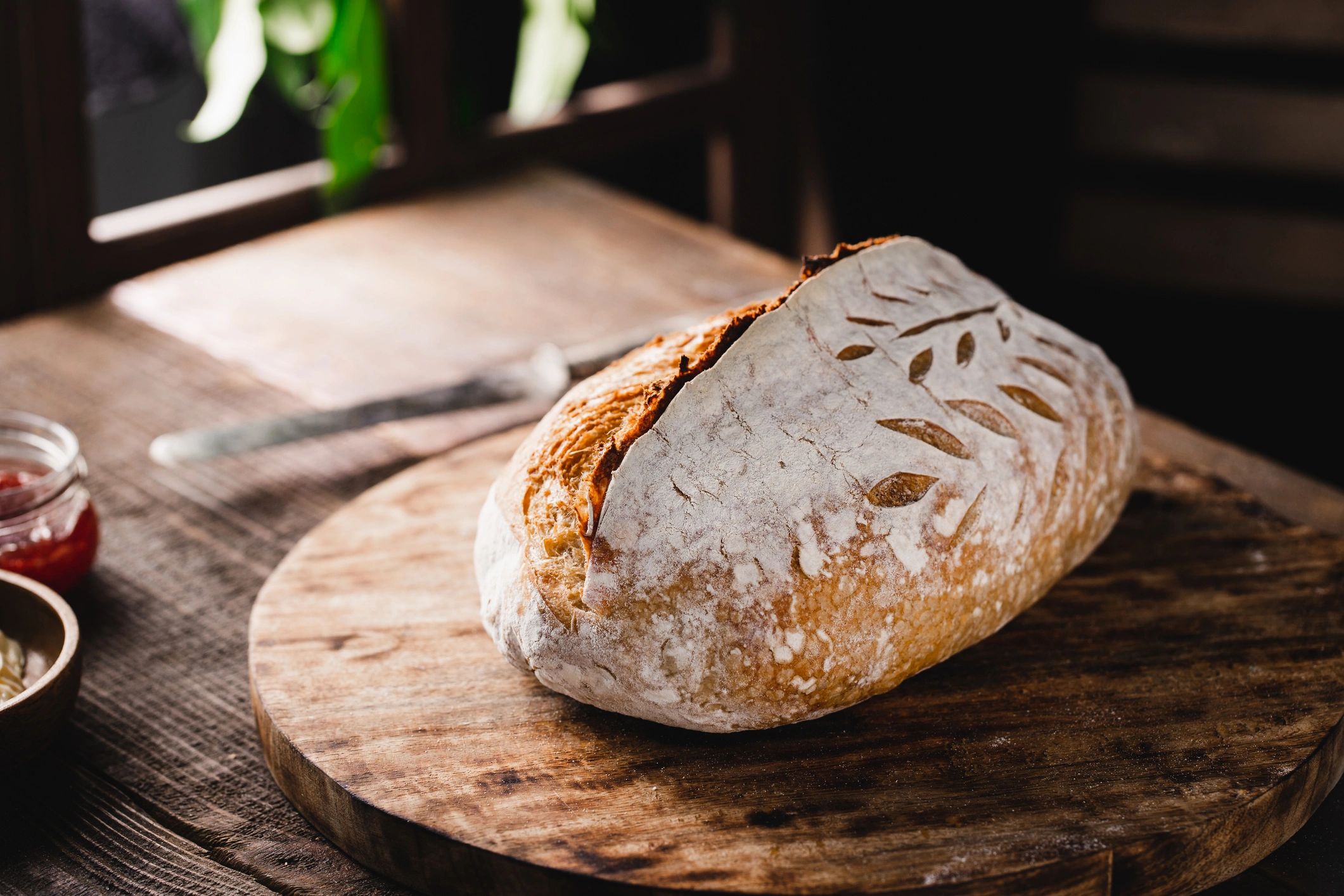 Freshly baked sourdough bread on a wooden counter