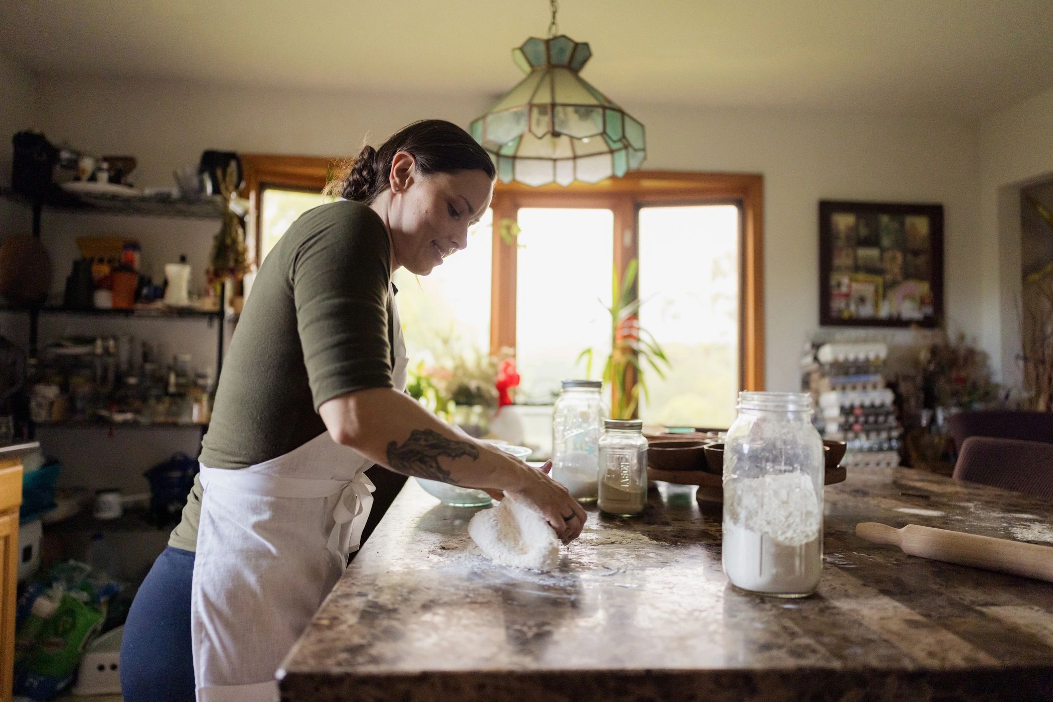 Person kneading dough on a countertop