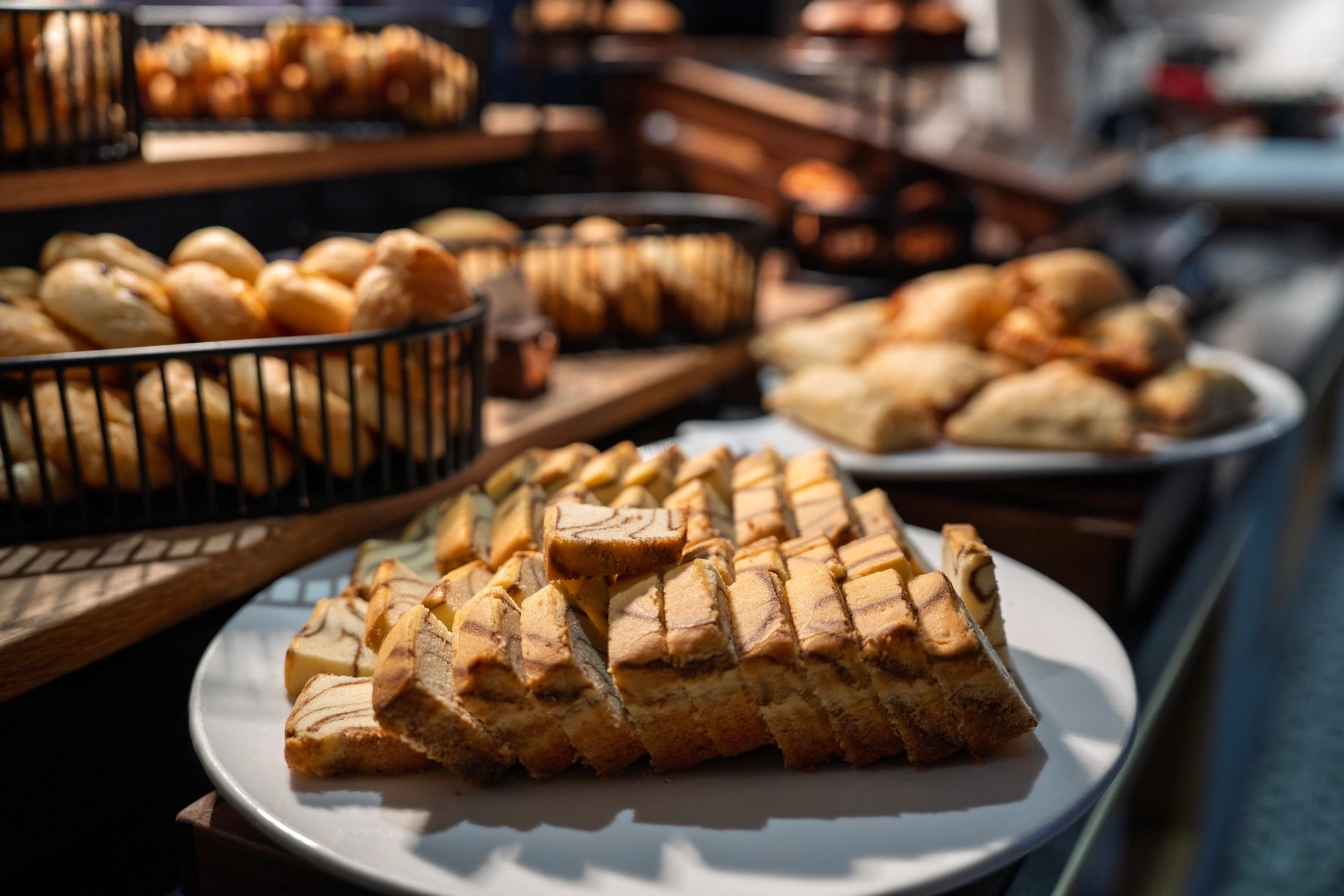 Assorted mini pastries arranged on a buffet counter